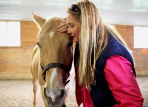 Veteran Eadyie Davis of Marlborough shared a quiet moment with therapy horse Creek. ~ Wendy Maeda/Globe Staff